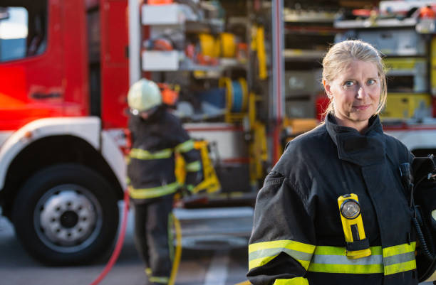 istock Portrait Of Female Firefighter 1388402619