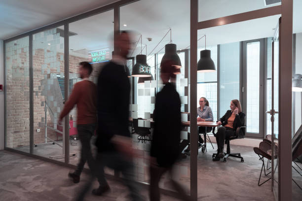 istock Successful team. Group of young multi-ethnic business people working and communicating together in creative office. Selective focus 1388403638