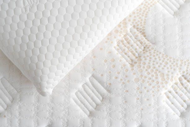 istock Hypoallergenic pillow with memory foam over topper on bed 1388404591