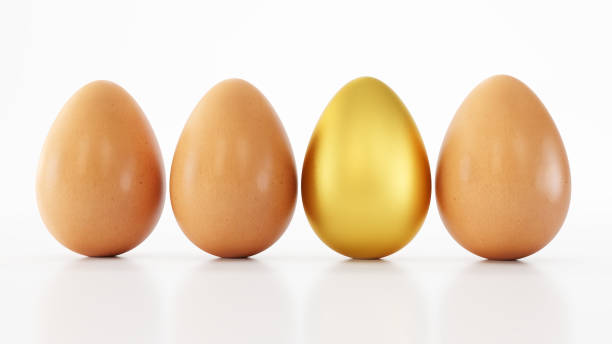 istock One gold egg in a pack isolated on white background, One golden egg among white eggs, 1388404647