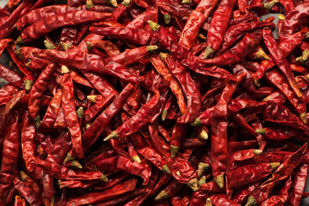 красный горячий перец чили фона - pepper spice dried plant image стоковые фото и изображения