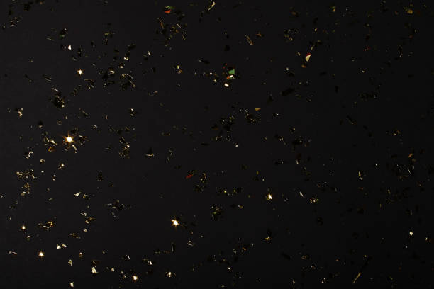 istock Golden leafs on the black backgrond.Overlay layer,Selective focus. 1388405332
