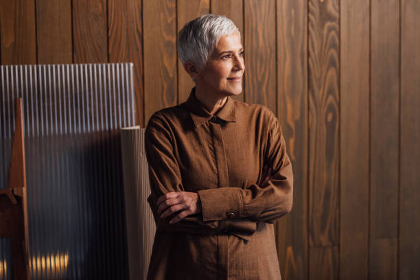 istock Confident Senior Architect Wearing a Brown Shirt, Standing in her Studio 1388406209