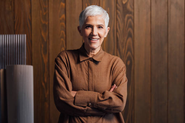 istock Confident Senior Architect Wearing a Brown Shirt, Standing in her Studio 1388406214