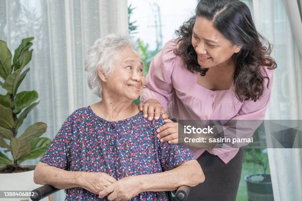 Help Asian Senior Or Elderly Old Lady Woman Sitting On Wheelchair And Wearing A Face Mask For Protect Safety Infection Covid 19 Coronavirus Stock Photo - Download Image Now