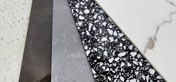 istock close up view of different quartz samples swatch for kitchen counter top. multi color and texture of artificial stones including marble, pebbles, grainy texture (focused at black pebble). 1388408795