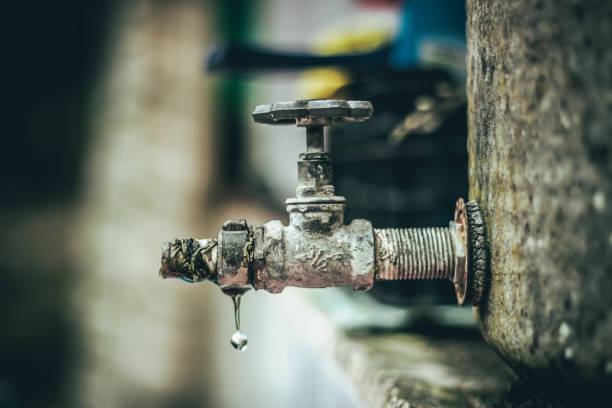 istock Drops of water from the old faucet,selective focus. 1388409572
