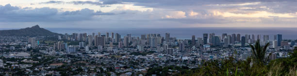istock Honolulu skyline under cloudy skies just before sunset 1388410720