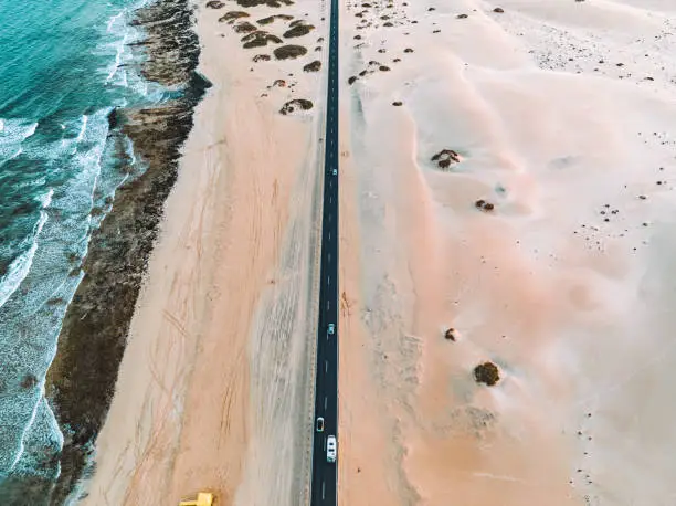 drone-shot (aerial view) Natural Park of the Dunes of Corralejo (Fuerteventura) with street