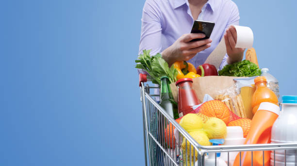 istock Woman checking the grocery receipt 1388412490