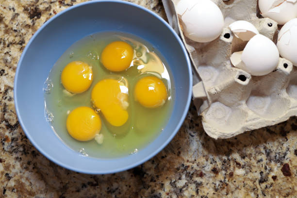 istock Fresh raw organic eggs in a bowl on a kitchen counter 1388412546