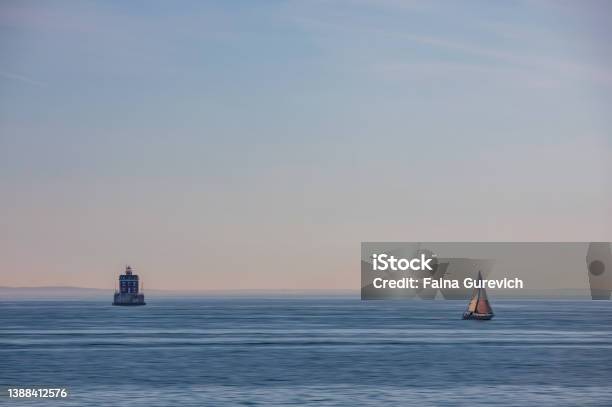 A Boat Passing New London Ledge Lighthouse In Groton Connecticut Adamski Effect Stock Photo - Download Image Now