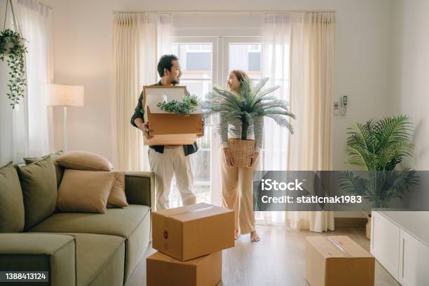Asian Couple Moving In New House Stock Photo - Download Image Now - Home Ownership, Moving House, Couple - Relationship