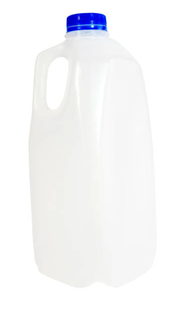 Empty milk container Empty plastic milk container with blue cap. milk jug stock pictures, royalty-free photos & images