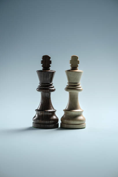 istock Black and white kings standing next to each other 1388415772