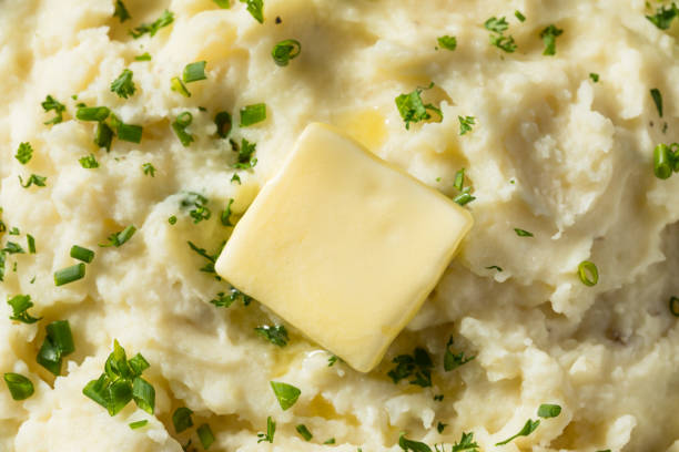 Homemade Creamy Mashed Potatoes Homemade Creamy Mashed Potatoes with Butter and Parsley mashed potatoes stock pictures, royalty-free photos & images