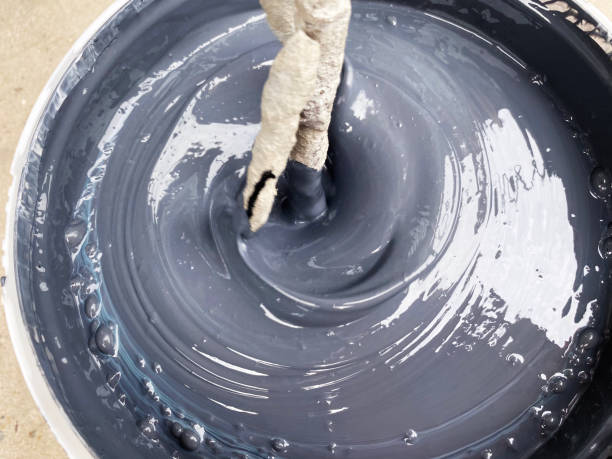 istock Building mixer for mixing paint. Mixing process 1388417911