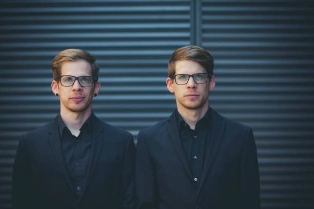 istock twin brothers standing next to each other 1388418014