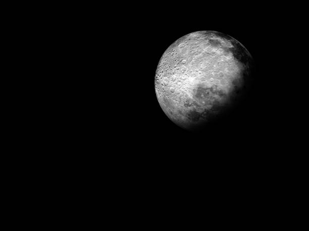 istock Big embossed Moon Against a Black Outer Space BackgroundWaxing crescent moon with a night sky stars background. Amazing view of the tiny moon surface illuminated by the sun and the dark side of the moon. Dramatical line cut out in the starry night sky 1388418961
