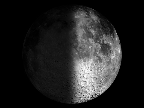 Photo of the first quarter moon in high resolution with extreme level of detail and clearly visible craters on the surface and peaks on the grazing angle.