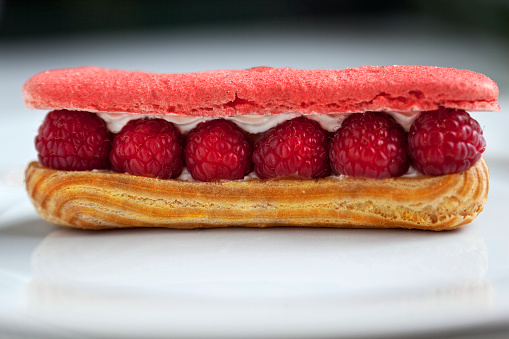 Close up of a Raspberry cake on a white table in a bakery