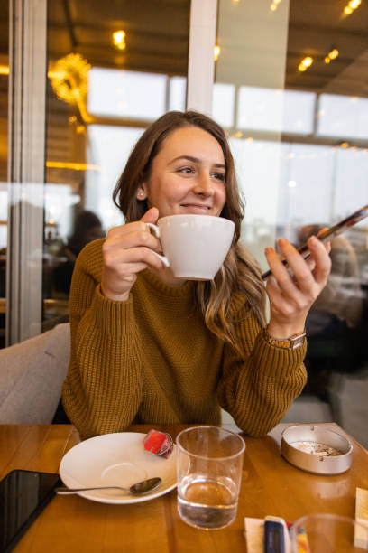 istock Smilling woman at cafe 1388420429