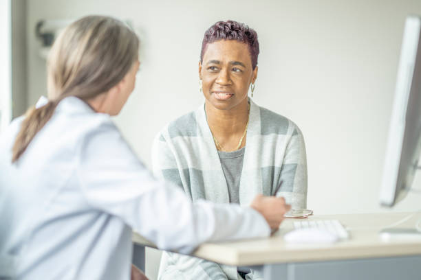 istock Senior Woman At the Doctors 1388420542