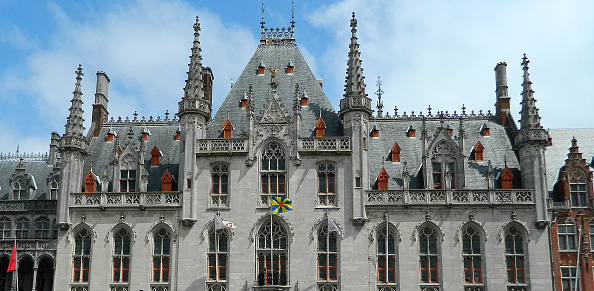 Bruges, Belgium - June 2, 2013: City Hall on the Burg (Town Hall Square), Bruges. Bruges has most of its medieval architecture well preserved and has been designated a UNESCO World Heritage Site. It is the capital and largest city of the province of West Flanders.