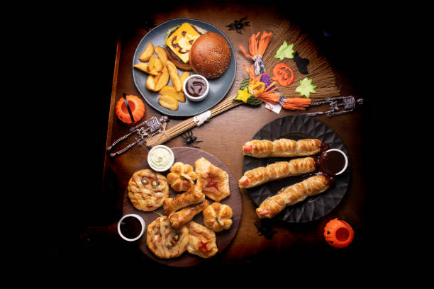 istock gloomy table set for with delights for halloween top view 1388421867