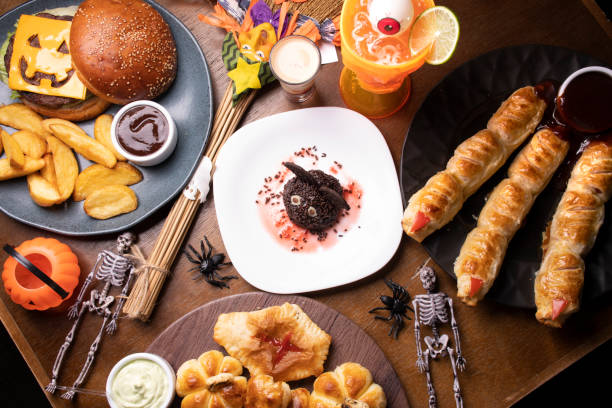 istock gloomy table set for with delights for halloween top view with bat candy chocolate dessert 1388421877
