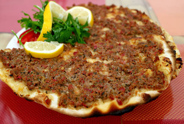 istock Plate of Lahmacun, a Thin and Crispy Turkish Pizza Topped with Spiced Minced Meat 1388422021