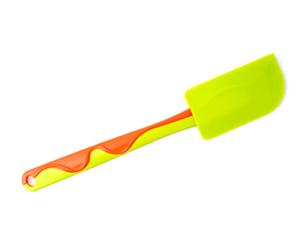 istock Green-orange silicone culinary spatula. View from above 1388422022
