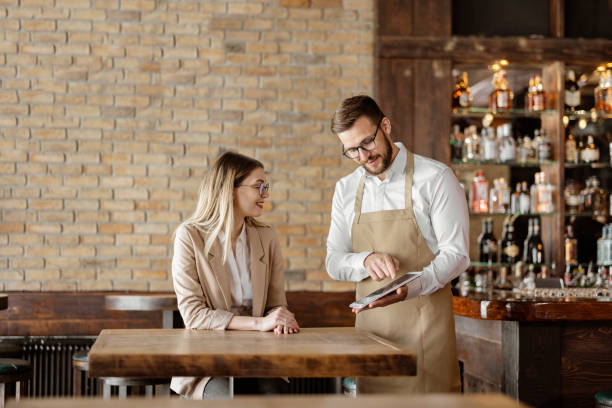 istock Male Waiter Using Digital Tablet to Take an Order 1388422831
