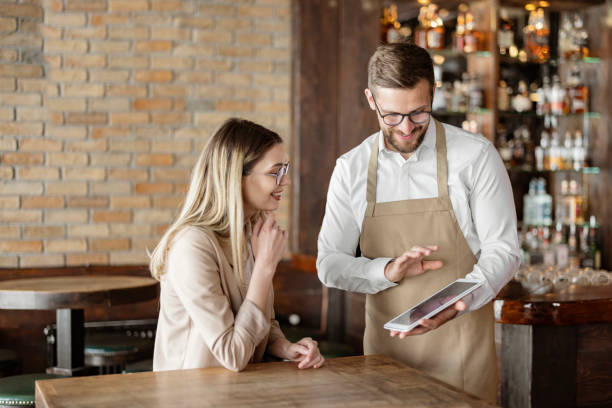 istock Male Waiter Using Digital Tablet to Take an Order 1388422900