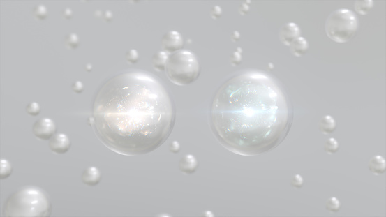 Macro shot of various White Pearl bubbles in water rising up on light background. Beauty glossy Moisturizing bubble blobs or drops 3D Rendering 6k. Vitamin for personal care and beauty concept.