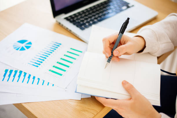 istock Woman calculating finances 1388424516