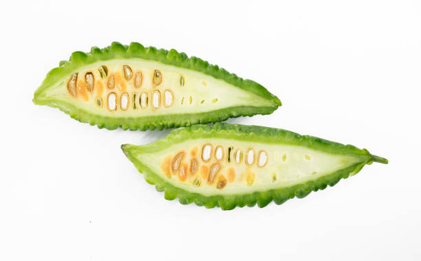 istock bitter gourd or bitter melon isolated on white background, selective focus. 1388425580