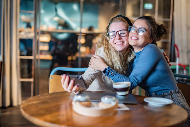 istock Two female friends taking selfie 1388425758