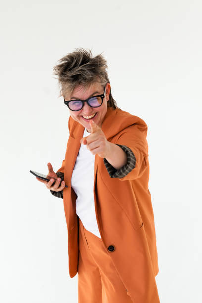 istock Happy queer person holding mobile pointing your finger 1388425809