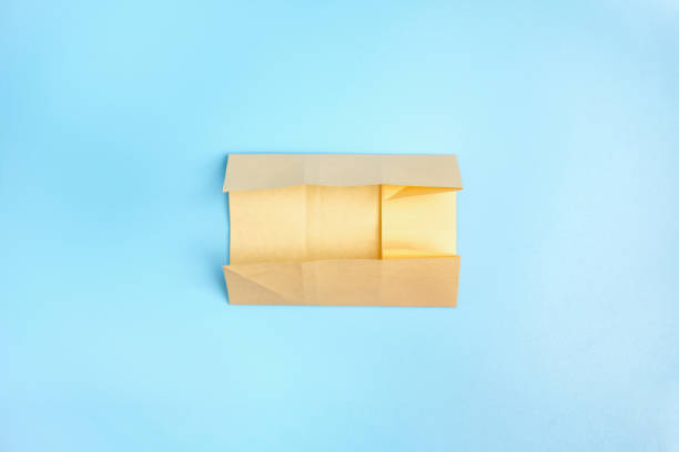 istock Origami Bunny. Step-by-step photo instruction on a blue background. Easter bunny. DIY concept. Step2. Rabbit 2023 1388426147