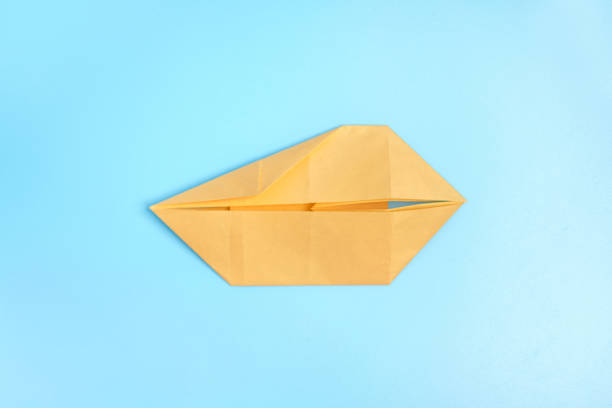 istock Origami Bunny. Step-by-step photo instruction on a blue background. Easter bunny. DIY concept. Step8. Rabbit 2023 1388427228