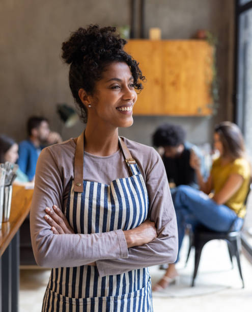 istock Happy waitress working at a restaurant 1388431080