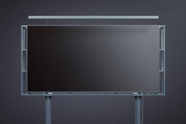 Blank black billboard on dark background, front view. Mockup, 3D Rendering stock photo