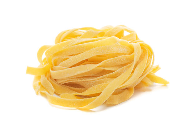 istock Fresh colored egg pappardelle pasta isolated on a white background 1388432521
