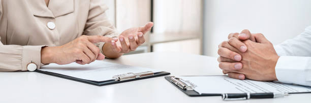 istock Woman employer is asking with candidate question and explaining about job description to applicant while sitting 1388432699