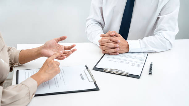 istock Woman employer is asking with candidate question and explaining about job description to applicant while sitting 1388432704