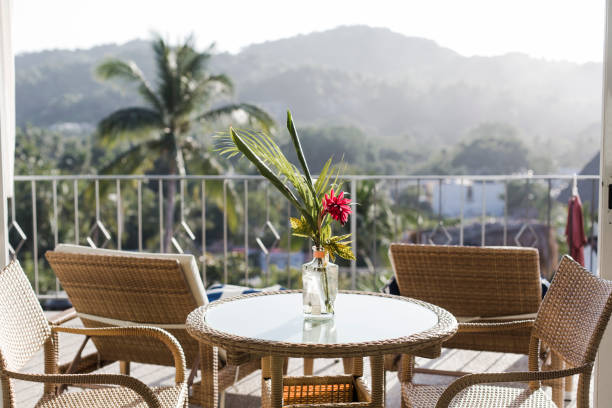 istock Outdoor table with a red flower 1388434684
