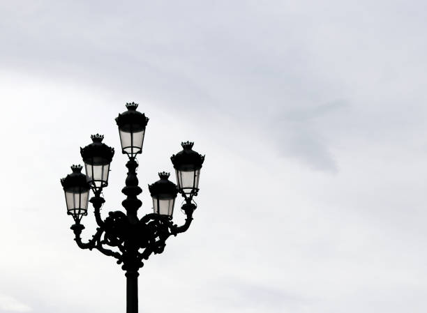 istock Lamppost of a city under a grey sky 1388436564
