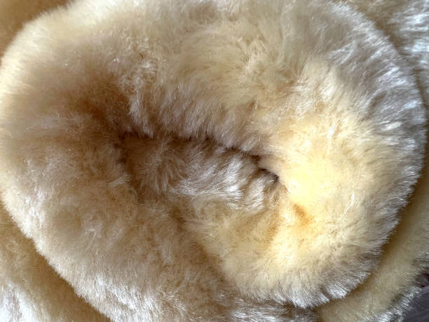 istock White beige and fine hairy fabric as texture or background. 1388440381