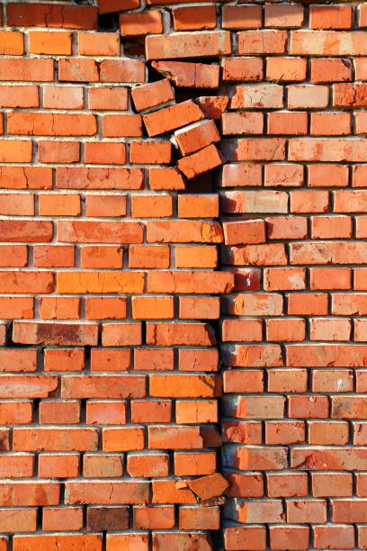 istock Old red brick house with cracks, old and new, wabisabi 1388442319